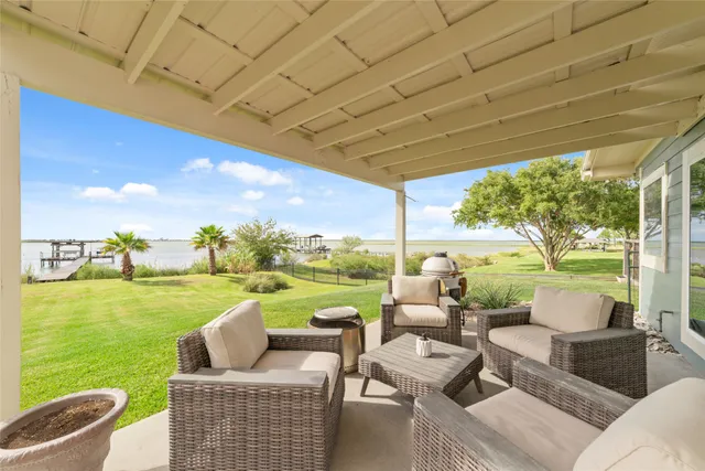 a view of a backyard with sitting area