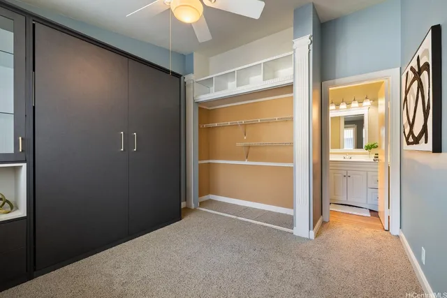 a view of empty room with a ceiling fan and window