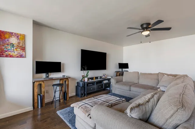 a balcony with table and chairs