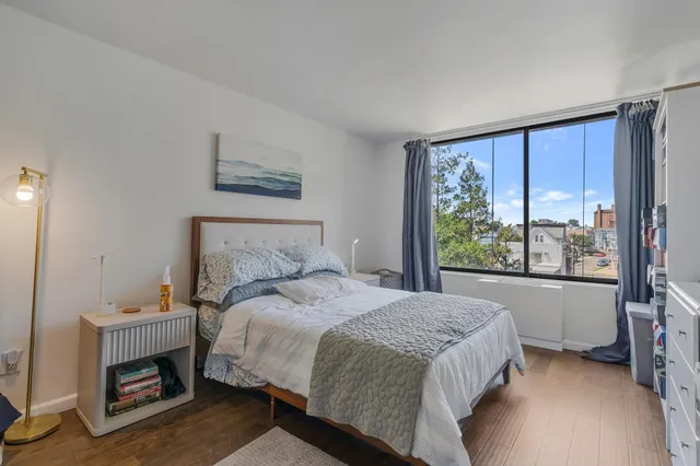 a bedroom with a bed and a walk in closet
