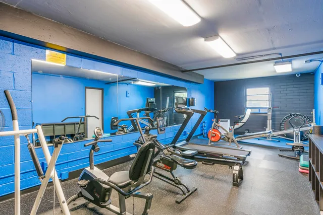 a room with lots of tables and chairs