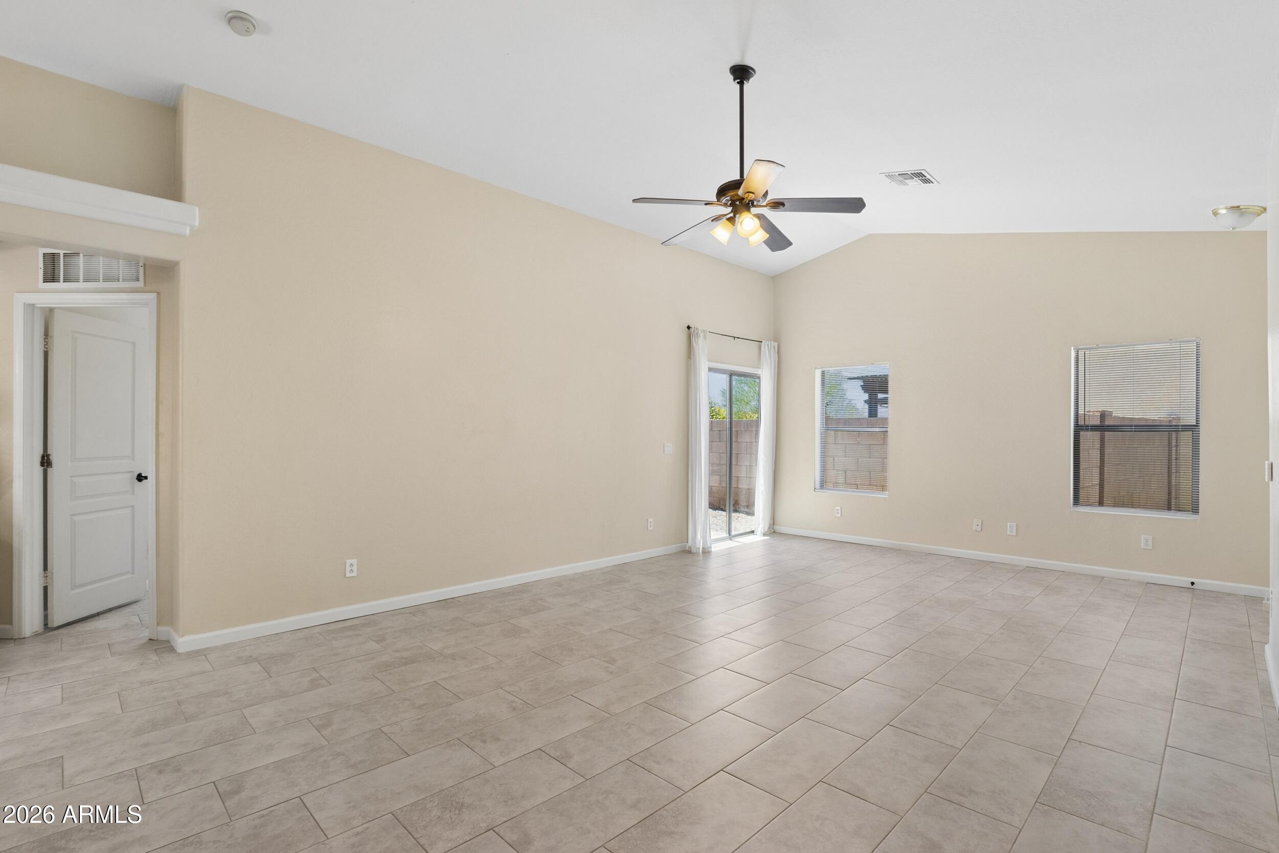 24025 West Pecan Road Buckeye, AZ 85326 - Photo 10 of 42 Looking from Kitchen towards Patio Door