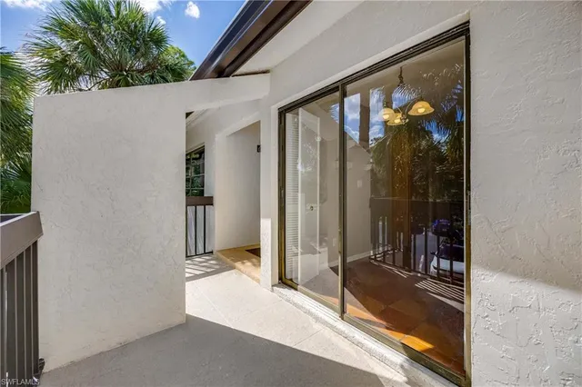 a view of a balcony and a potted plant