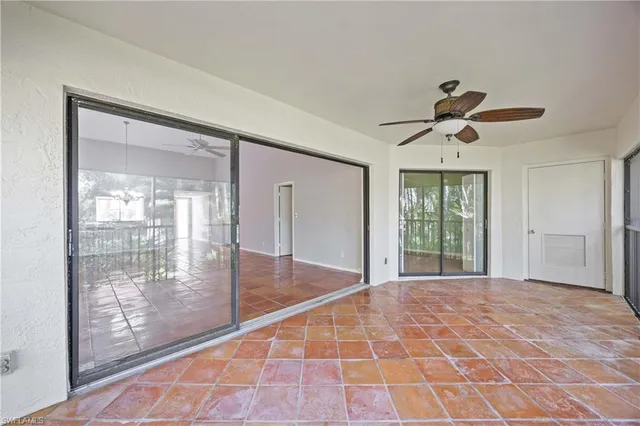 a view of an empty room with glass door