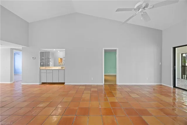 a view of an empty room with a bathroom