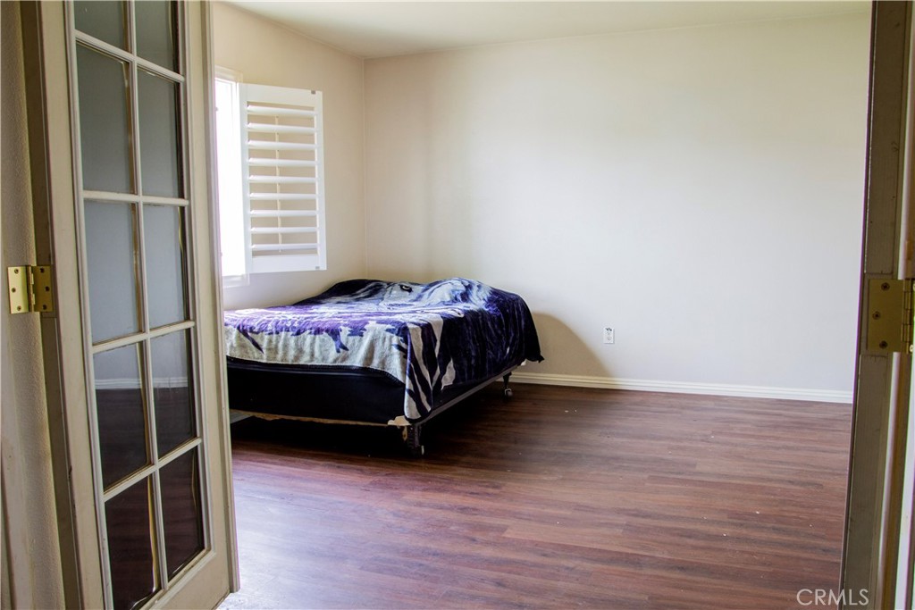 1325 Sunset Avenue Perris, CA 92571 - Photo 11 of 27 a bedroom with a bed and a window