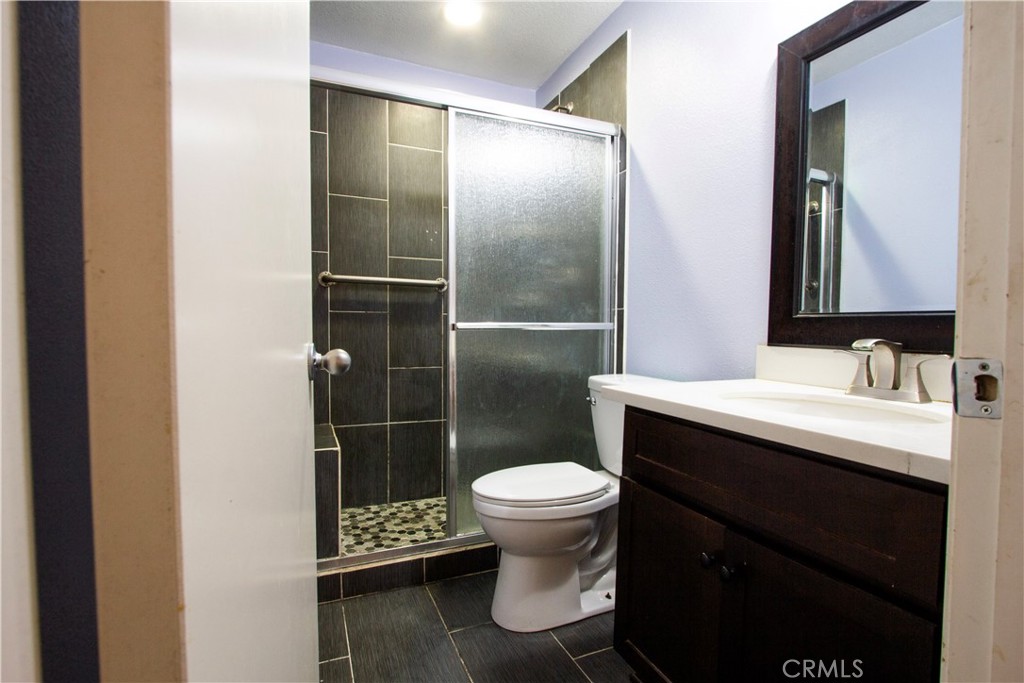 1325 Sunset Avenue Perris, CA 92571 - Photo 12 of 27 a bathroom with a sink toilet and a mirror