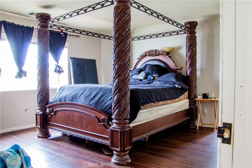 1325 Sunset Avenue Perris, CA 92571 - Photo 13 of 27 a view of bedroom with furniture and wooden floor