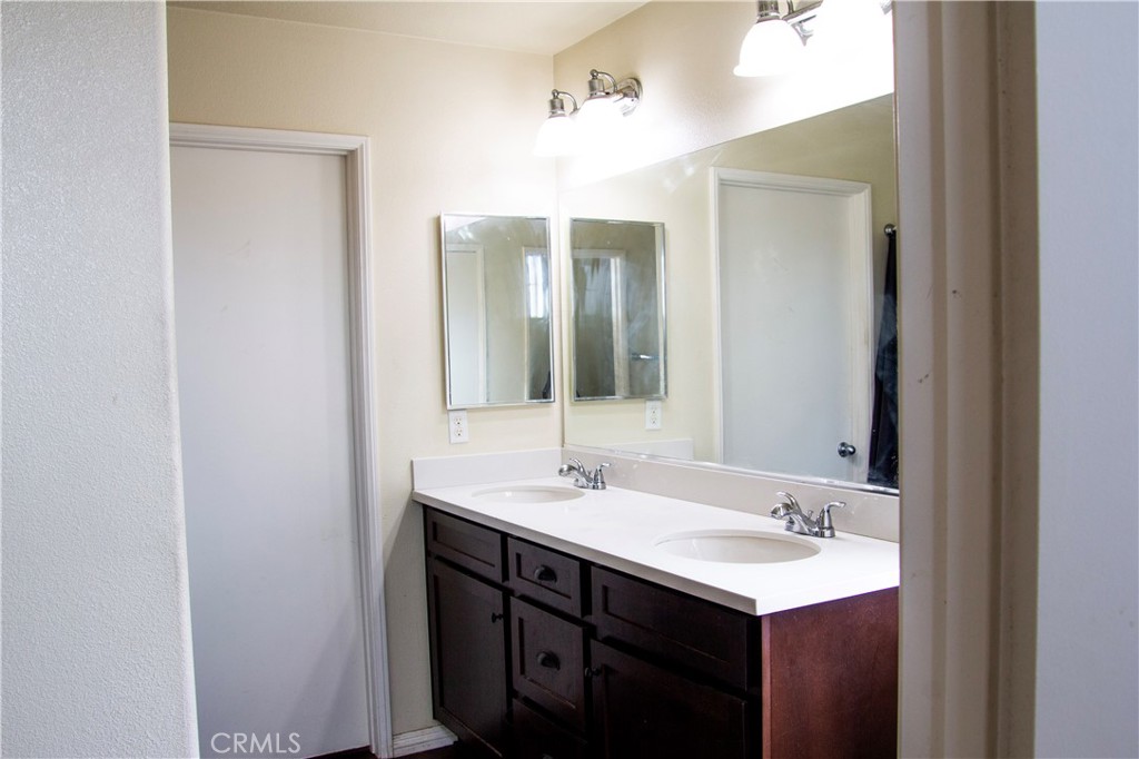 1325 Sunset Avenue Perris, CA 92571 - Photo 14 of 27 a bathroom with a sink and a mirror