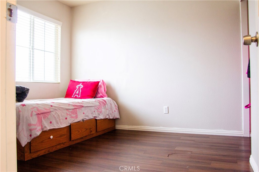 1325 Sunset Avenue Perris, CA 92571 - Photo 19 of 27 a bedroom with a bed and a window