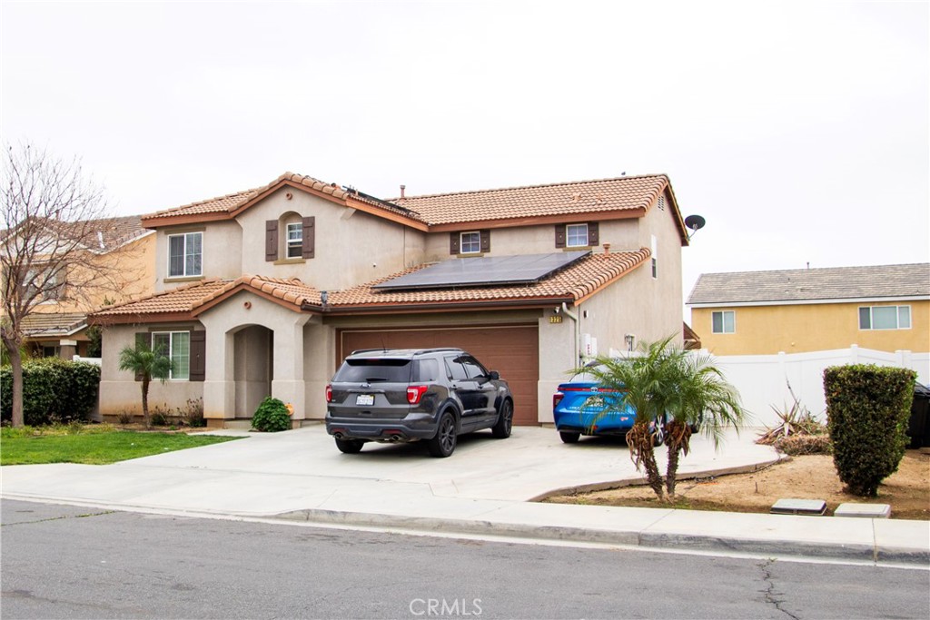 1325 Sunset Avenue Perris, CA 92571 - Photo 2 of 27 a car parked in front of a house
