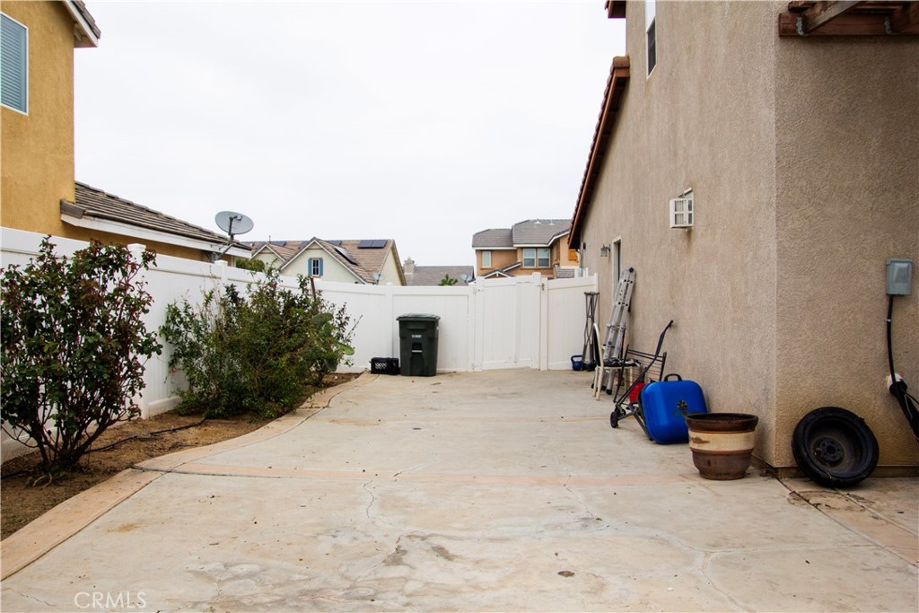 1325 Sunset Avenue Perris, CA 92571 - Photo 25 of 27 a view of a house with backyard space and basketball court