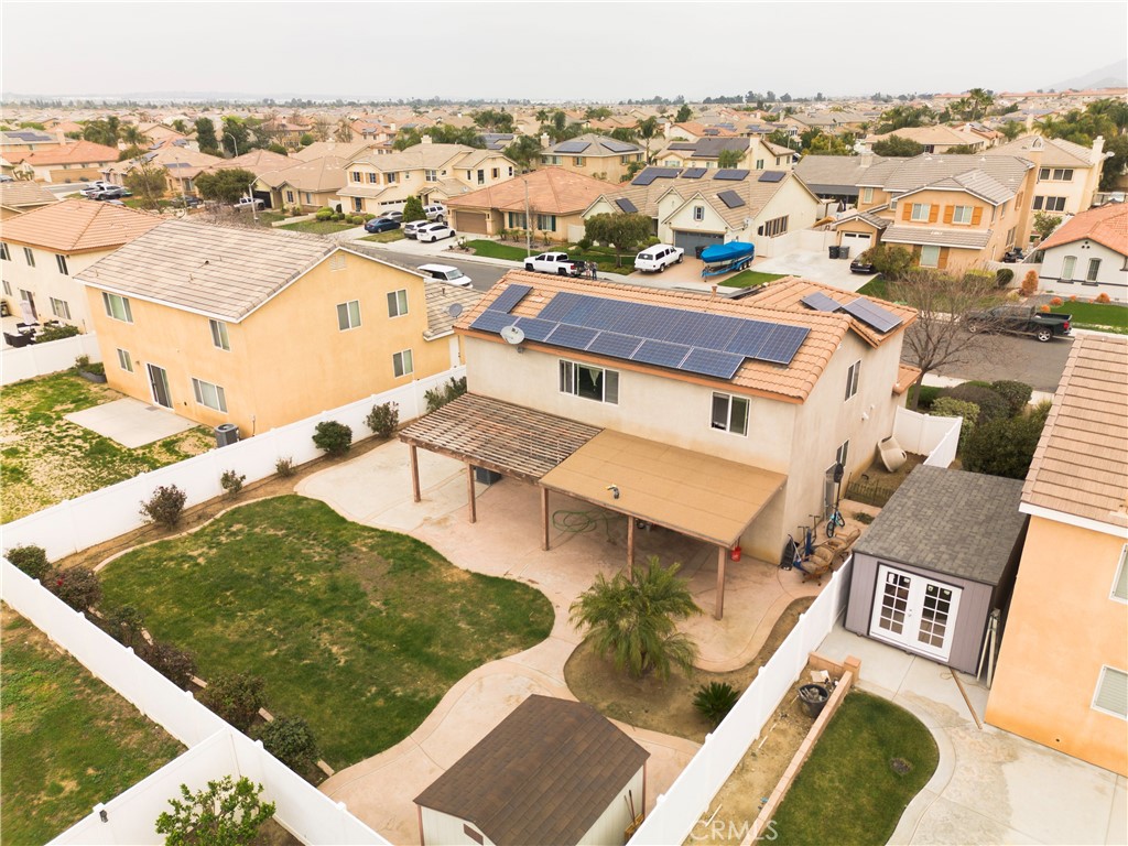 1325 Sunset Avenue Perris, CA 92571 - Photo 6 of 27 an aerial view of residential houses with outdoor space