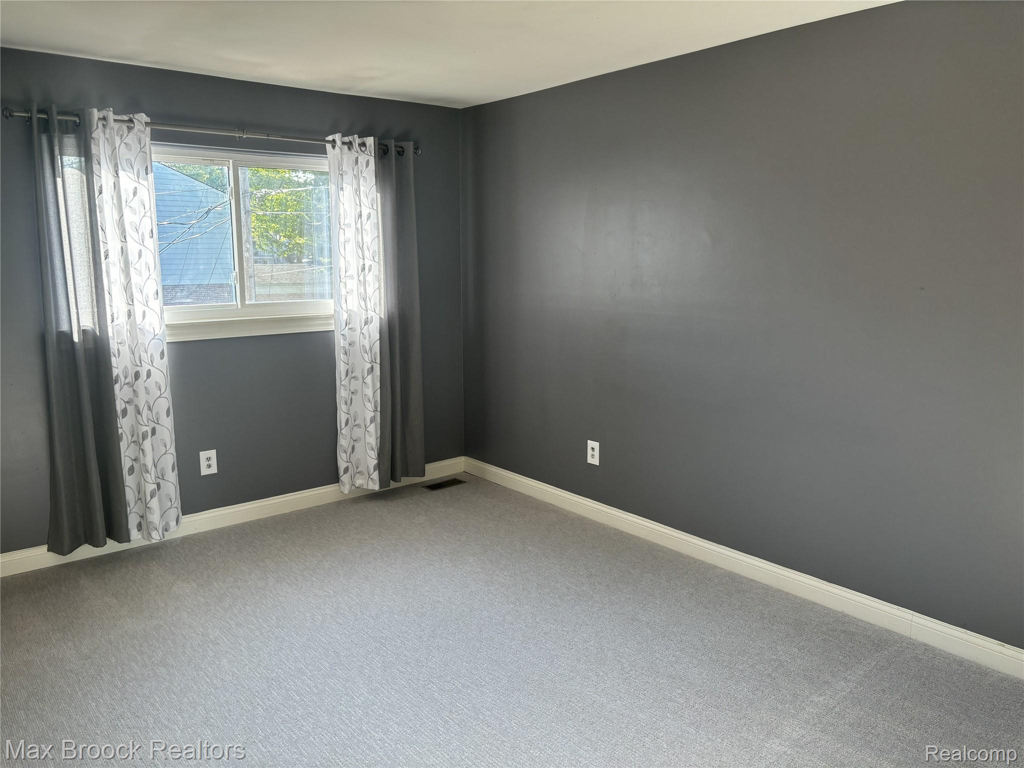 126 Manor Way Rochester, MI 48309 - Photo 18 of 31 Carpeted flooring, painted walls, and window with white trim