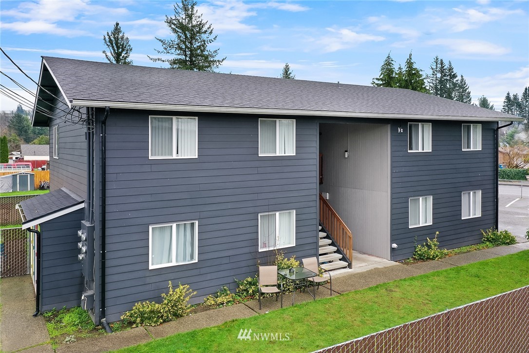 800 4th Street Sultan, WA 98294 - Photo 1 of 38 a brick house with a yard plants and large tree