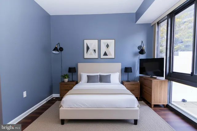 a view of a room with wooden floor