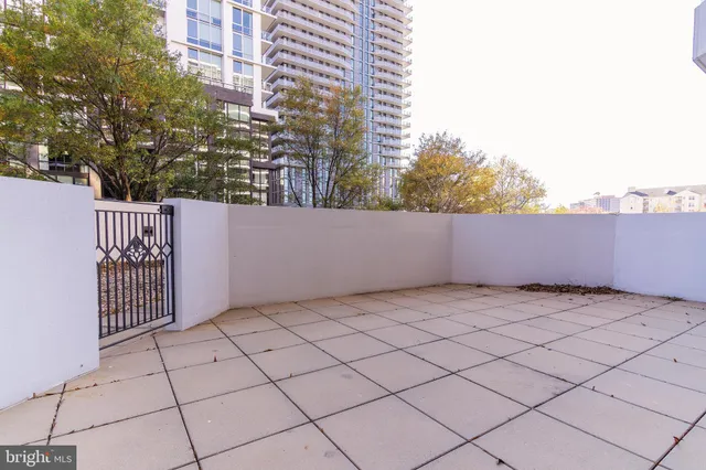 a view of a lobby with a chair and tables