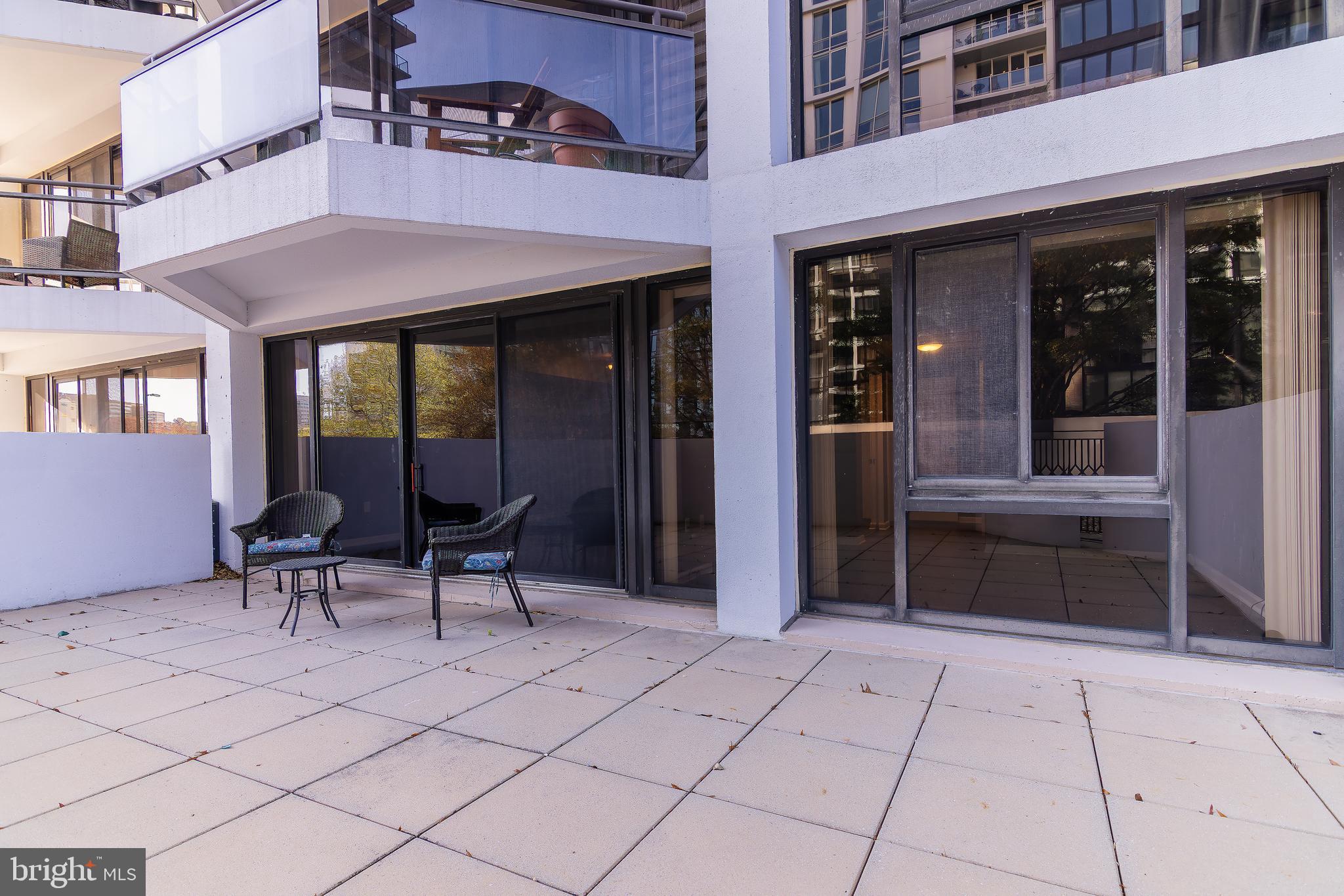 1530 Key Boulevard, Unit 205 Arlington, VA 22209 - Photo 21 of 33 a view of a lobby with a chair and tables