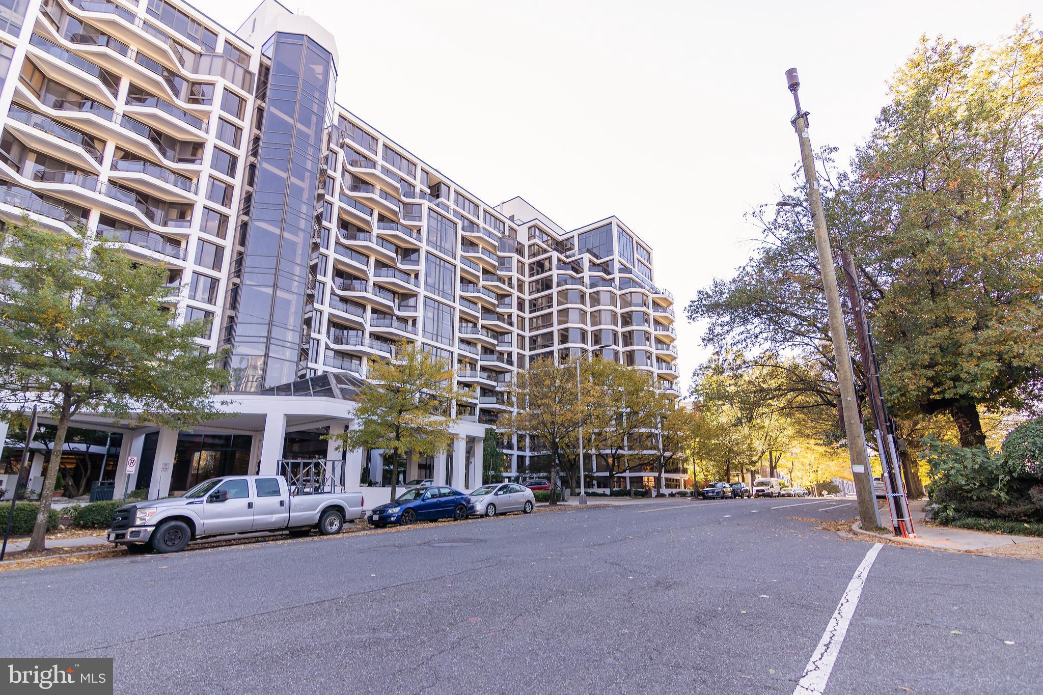 1530 Key Boulevard, Unit 205 Arlington, VA 22209 - Photo 3 of 33 a view of a building with cars parked