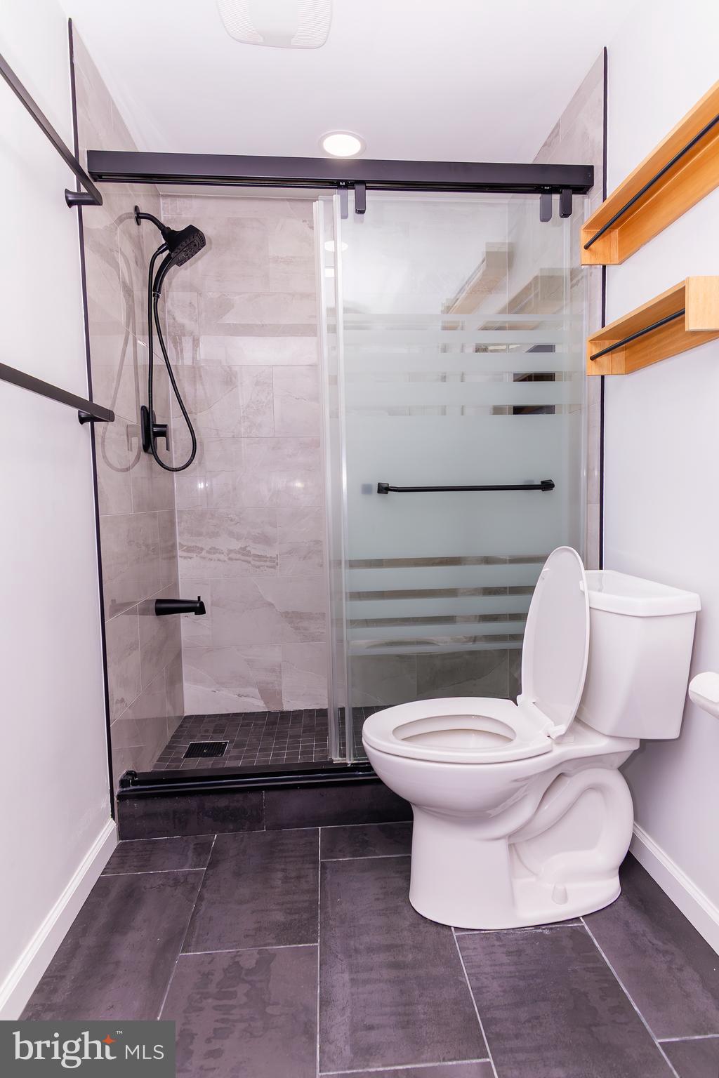 1530 Key Boulevard, Unit 205 Arlington, VA 22209 - Photo 32 of 33 a bathroom with a toilet and a shower