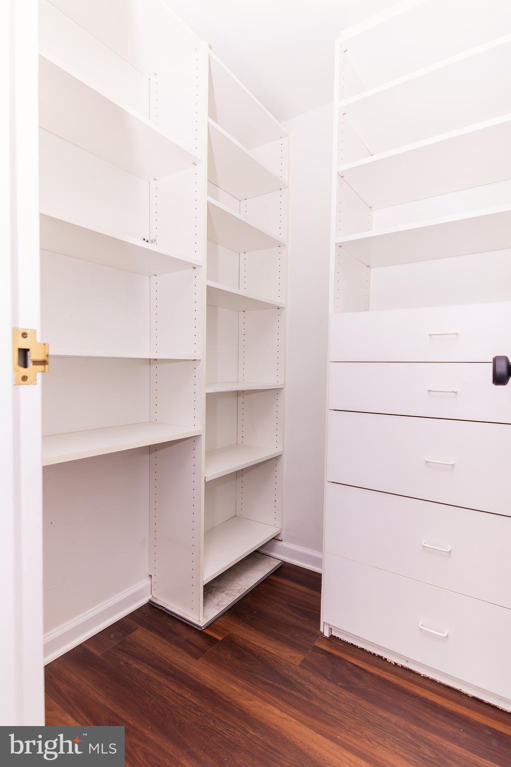 1530 Key Boulevard, Unit 205 Arlington, VA 22209 - Photo 33 of 33 a view of walk in closet with empty racks