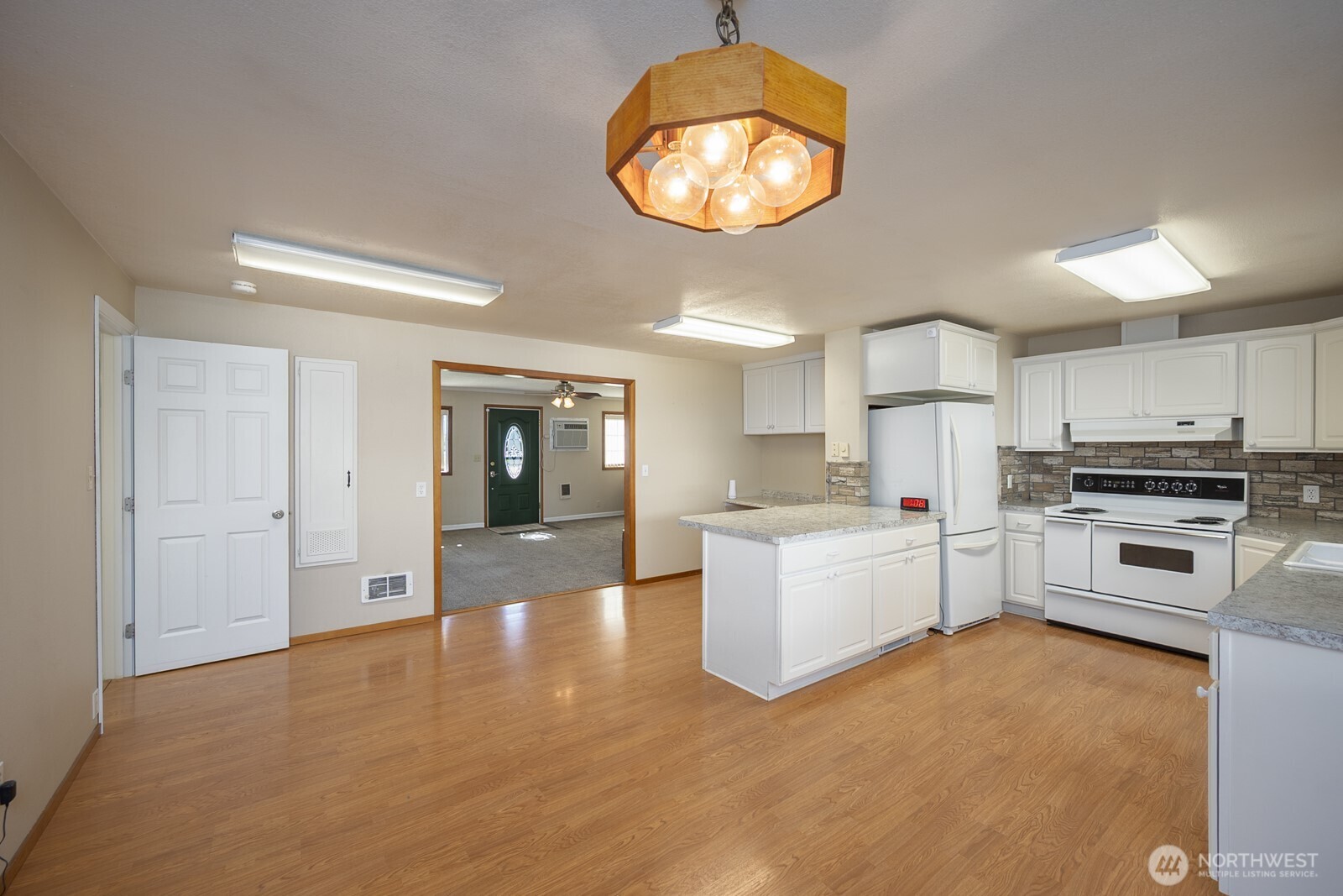 221 K Street Southwest Quincy, WA 98848 - Photo 14 of 38 a kitchen with a sink and a stove