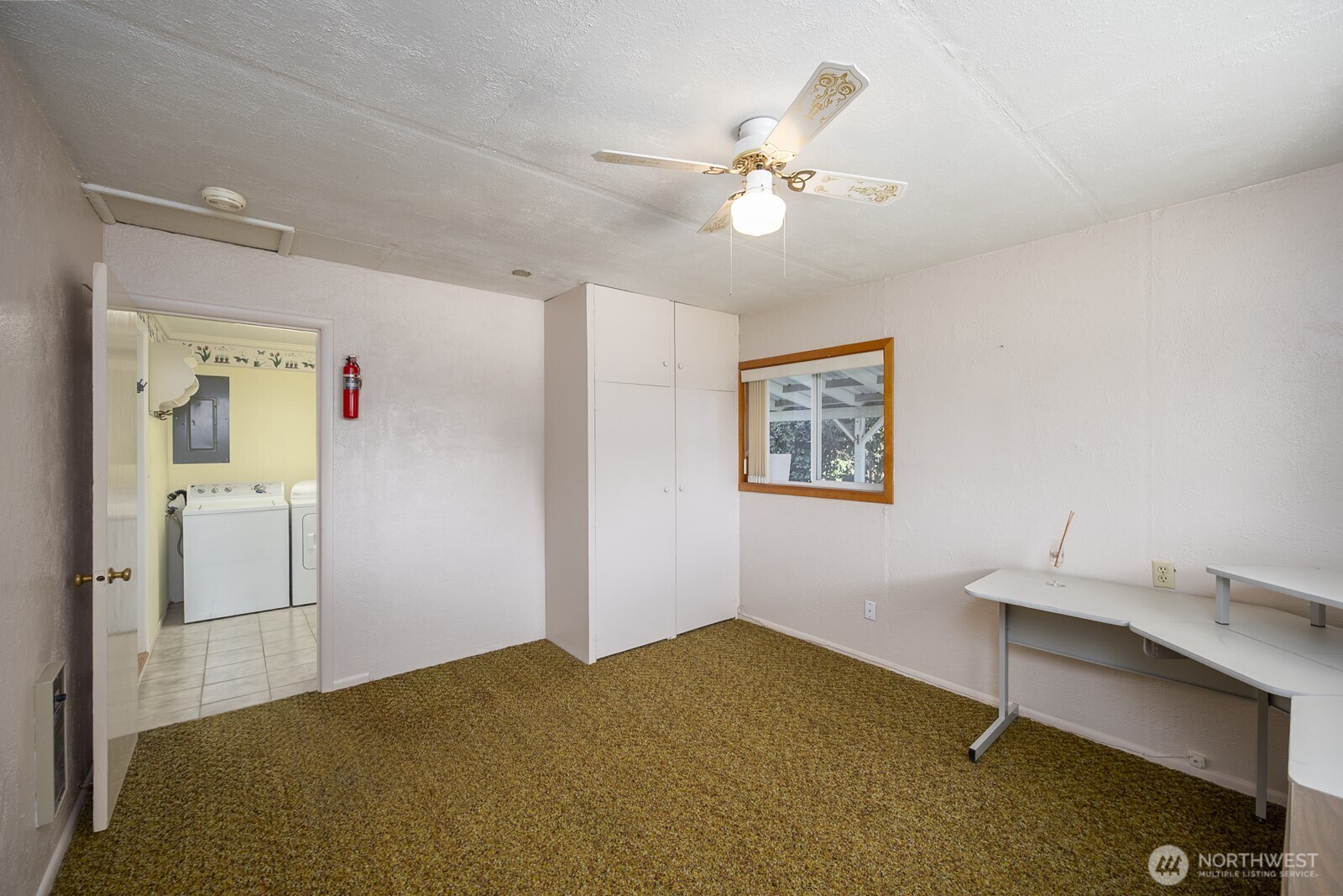 221 K Street Southwest Quincy, WA 98848 - Photo 32 of 38 a bedroom with a bed and a chandelier