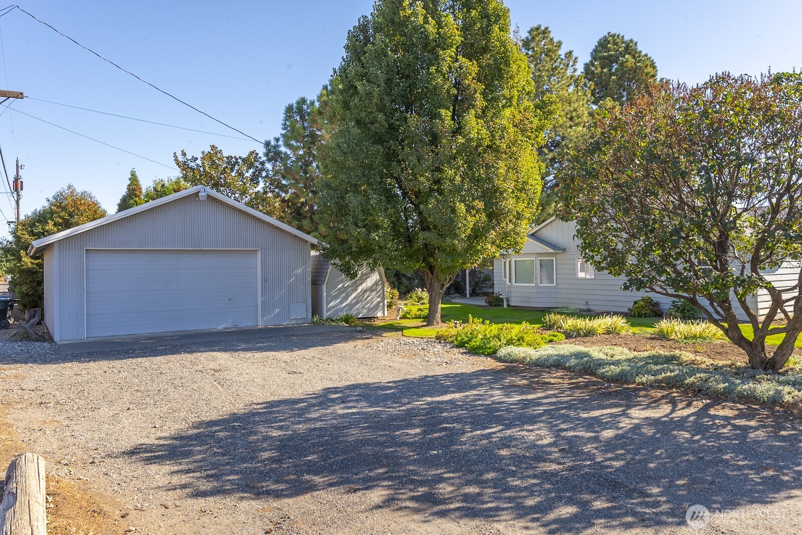 221 K Street Southwest Quincy, WA 98848 - Photo 34 of 38 a view of backyard of house with large trees
