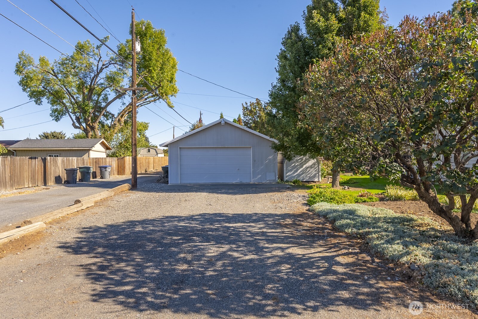 221 K Street Southwest Quincy, WA 98848 - Photo 37 of 38 a front view of a house with a yard and a garage