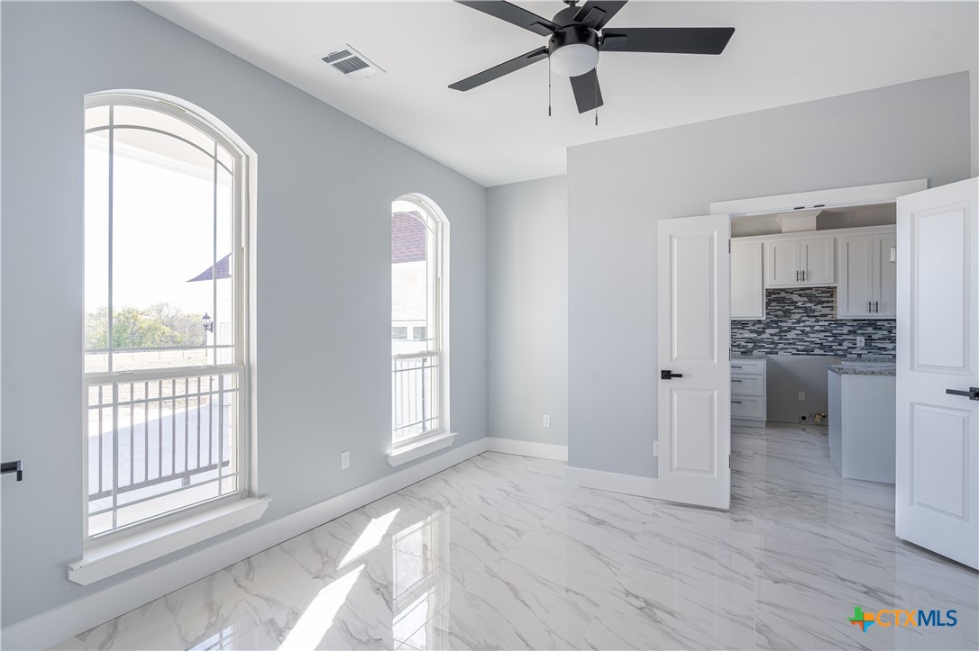 1000 Black Ankle Road Lockhart, TX 78644 - Photo 19 of 40 a view of a livingroom with a ceiling fan and window