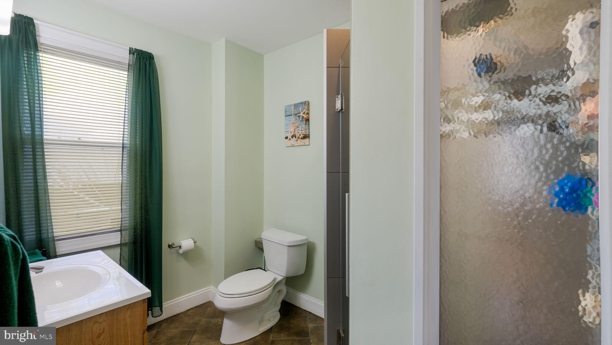 500 Prospect Road Warminster, PA 18974 - Photo 11 of 28 a white toilet sitting next to a bathroom sink