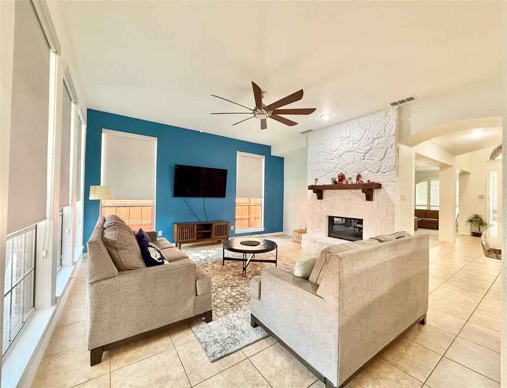2754 Ridge View Road Frisco, TX 75034 - Photo 8 of 34 a living room with furniture and a flat screen tv