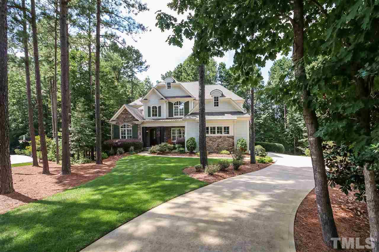 Long driveway allows the home to be set back into the woods for privacy and proximity to nature.