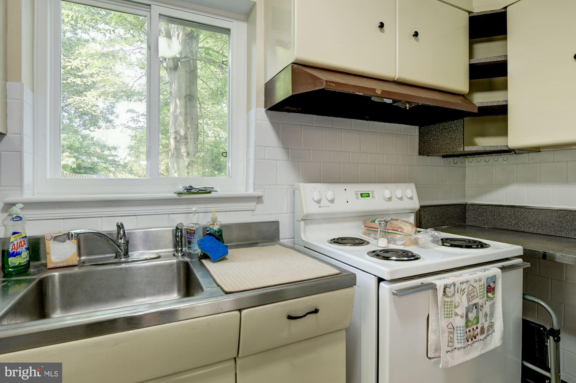 2901 Ivydale Street Silver Spring, MD 20902 - Photo 11 of 27 a kitchen with a stove and a sink