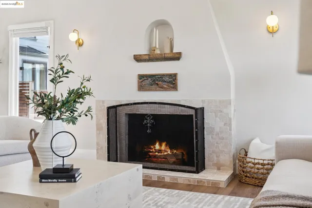 a view of a dining room with furniture a chandelier and wooden floor