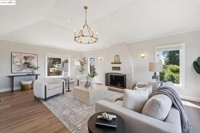 a view of a dining room with furniture and a chandelier