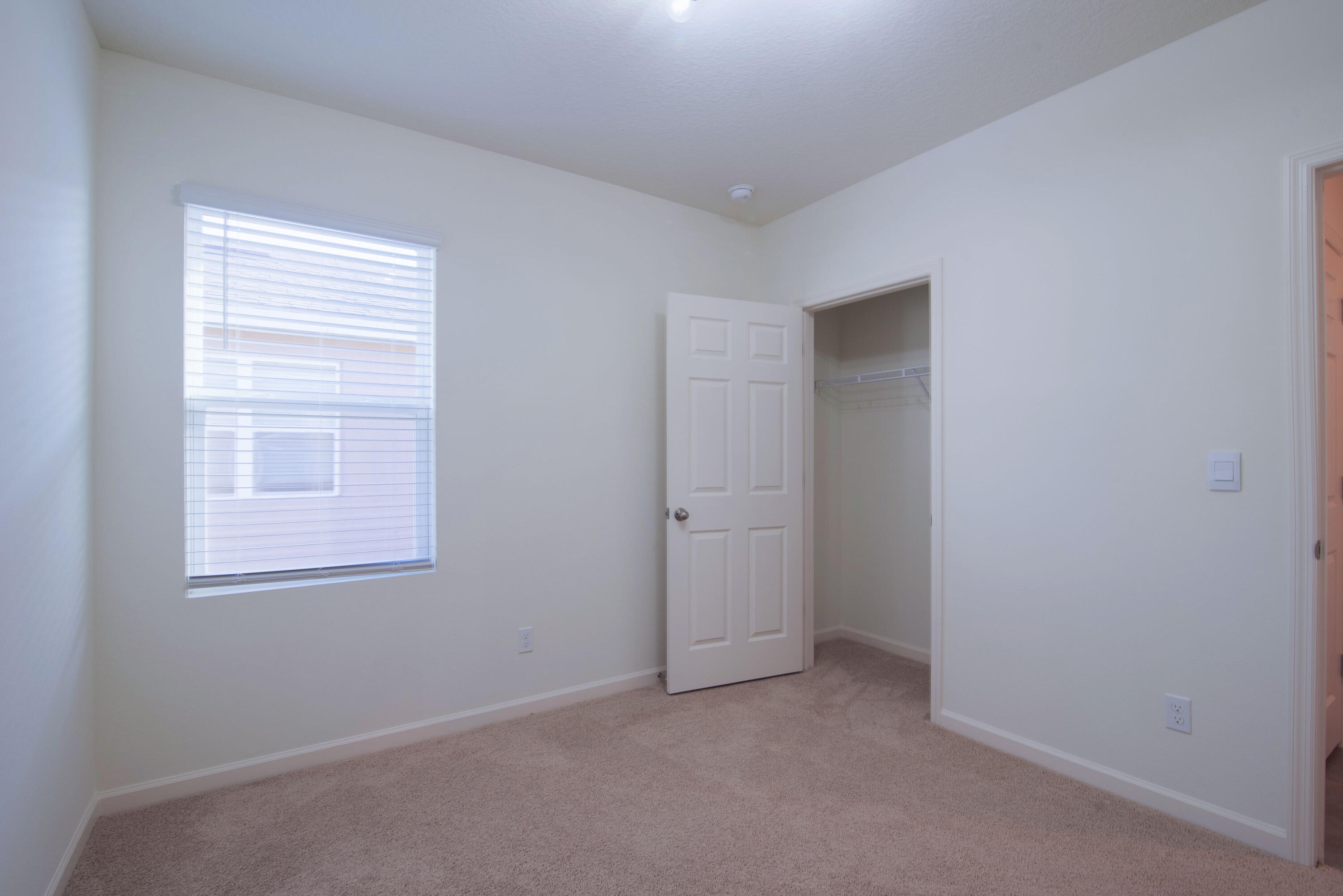 12152 Rimini Way Port St. Lucie, FL 34987 - Photo 11 of 24 an empty room with windows