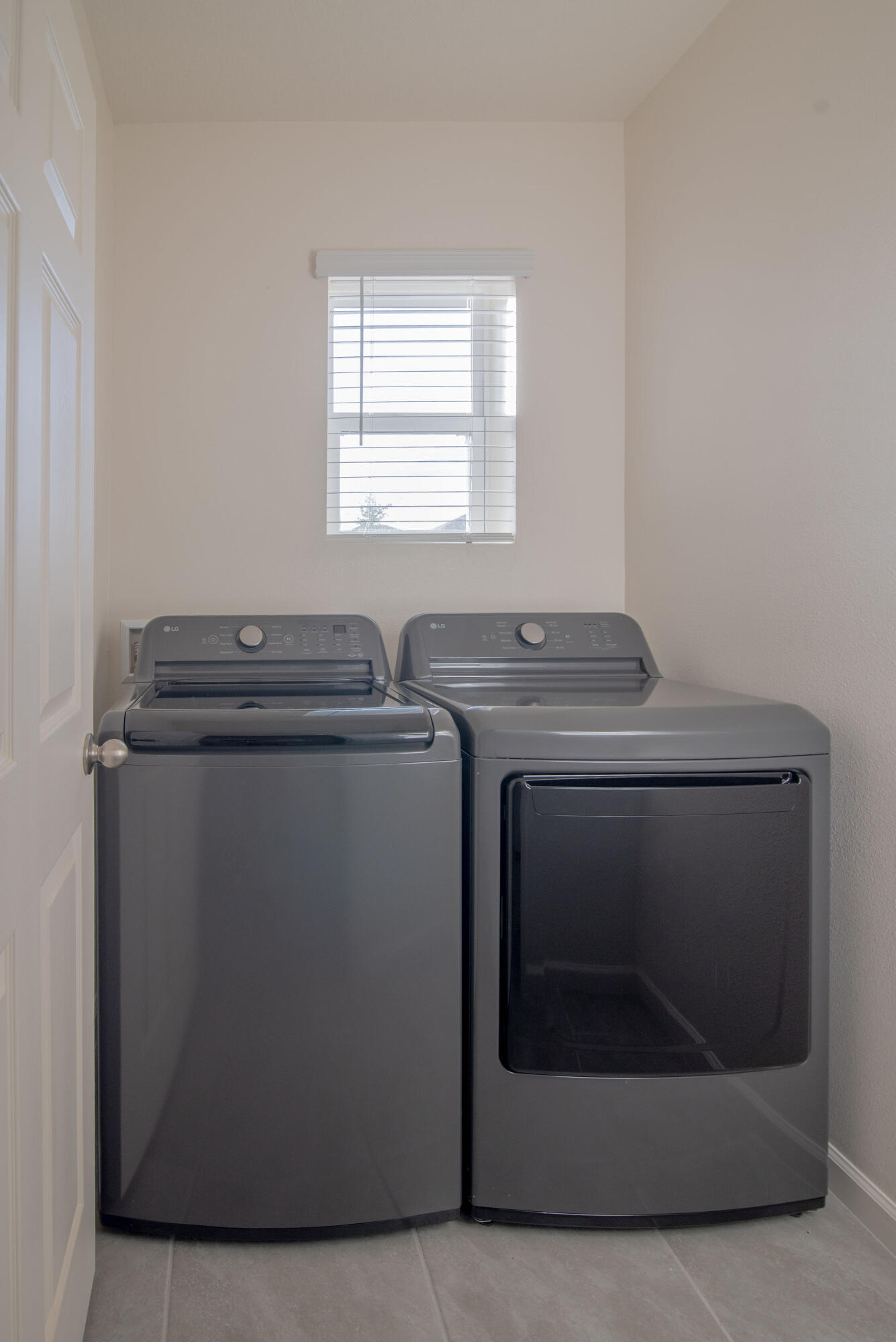 12152 Rimini Way Port St. Lucie, FL 34987 - Photo 16 of 24 a utility room with dryer and washer