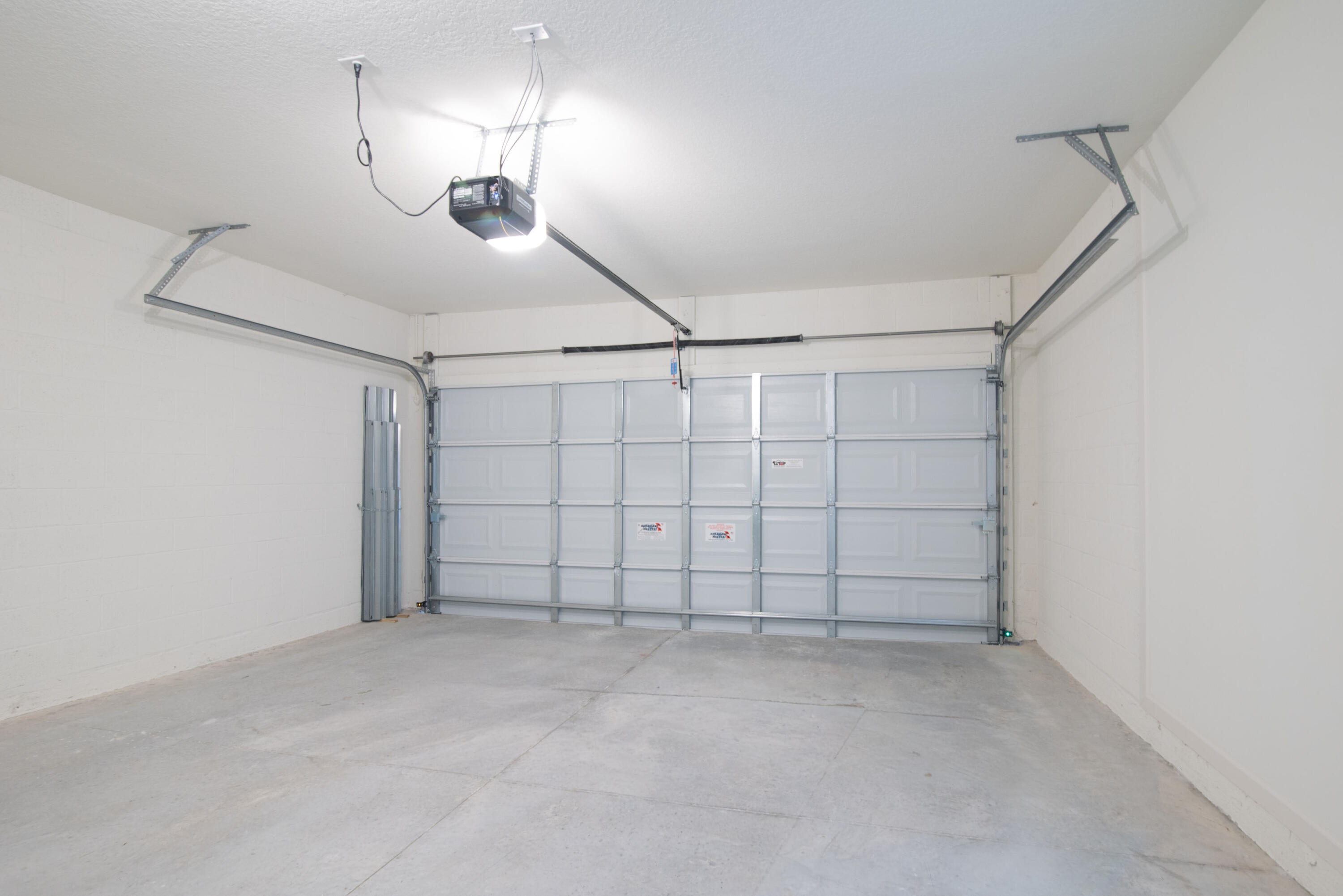 12152 Rimini Way Port St. Lucie, FL 34987 - Photo 17 of 24 a view of a garage