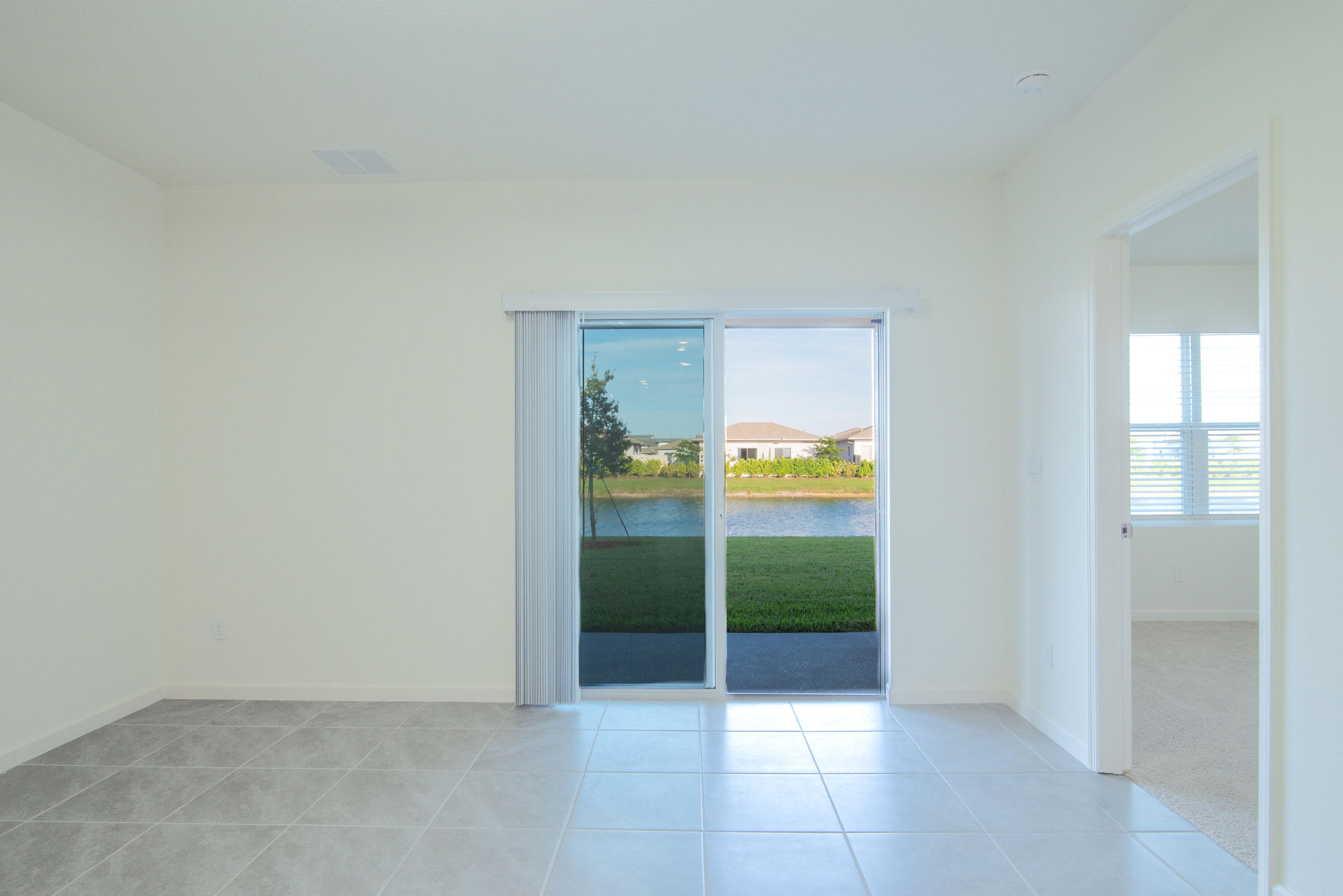 12152 Rimini Way Port St. Lucie, FL 34987 - Photo 6 of 24 a view of an entryway with outdoor space
