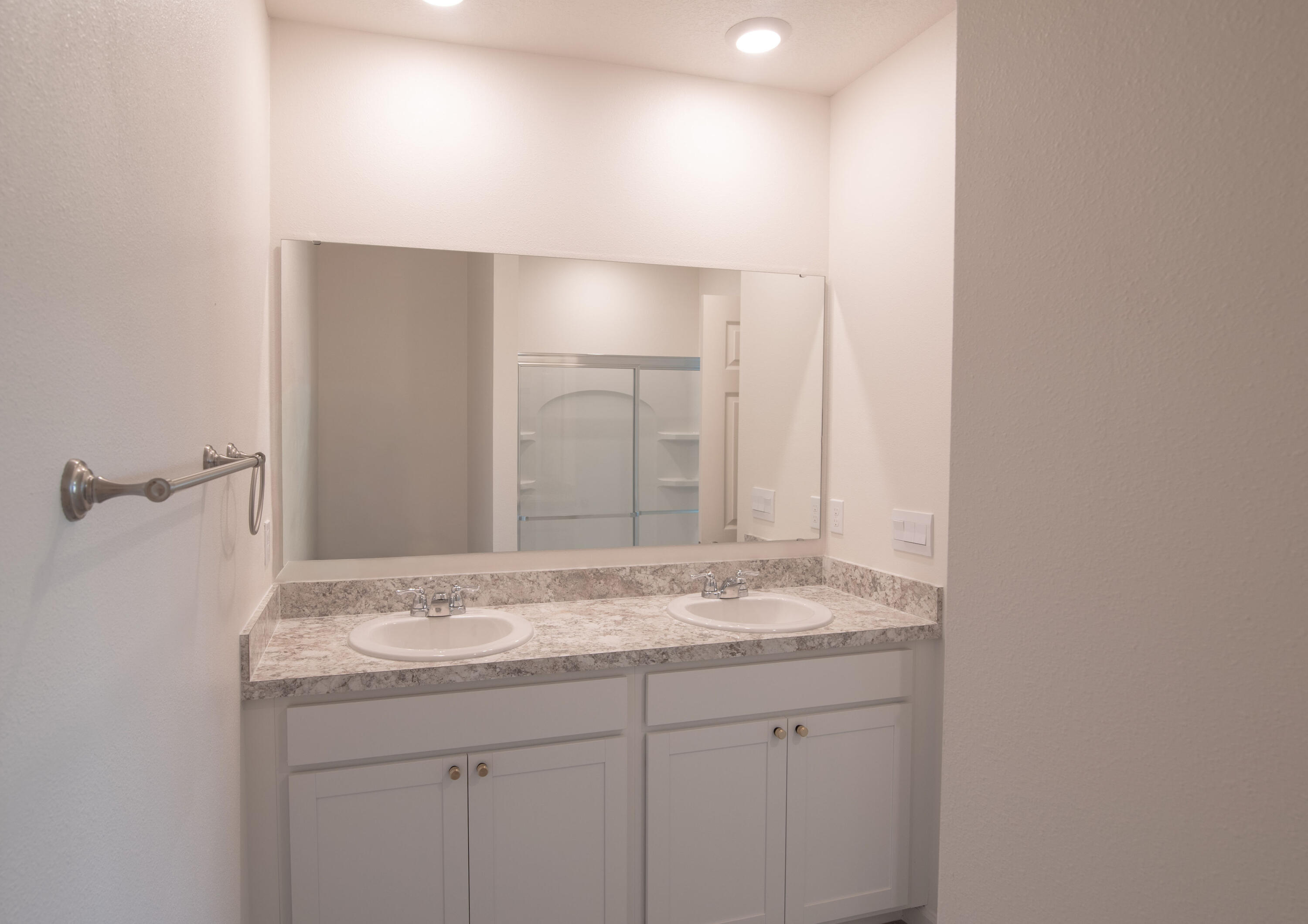 12152 Rimini Way Port St. Lucie, FL 34987 - Photo 9 of 24 a bathroom with a granite countertop sink and a mirror