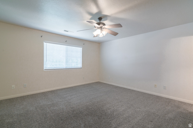 1735 West 540 North, Unit 1805 St. George, UT 84770 - Photo 42 of 64 Room featuring neutral-toned walls, a textured gray carpet, and white baseboards