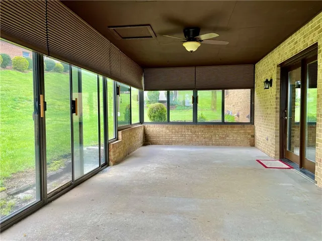 a view of an empty room with a large window