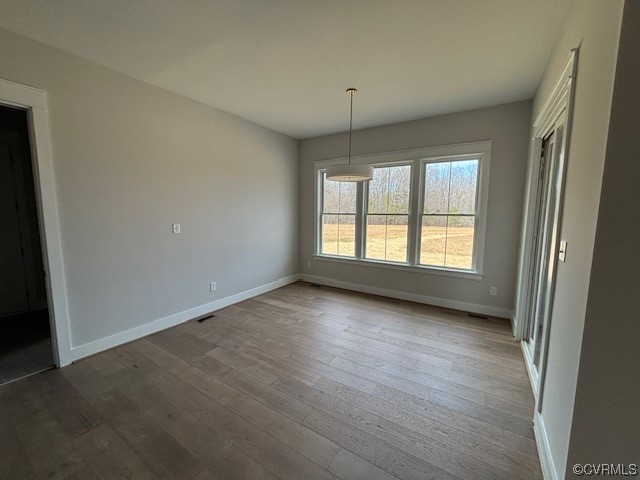 6090 Studley Road Hanover, VA 23069 - Photo 13 of 17 an empty room with wooden floor and windows