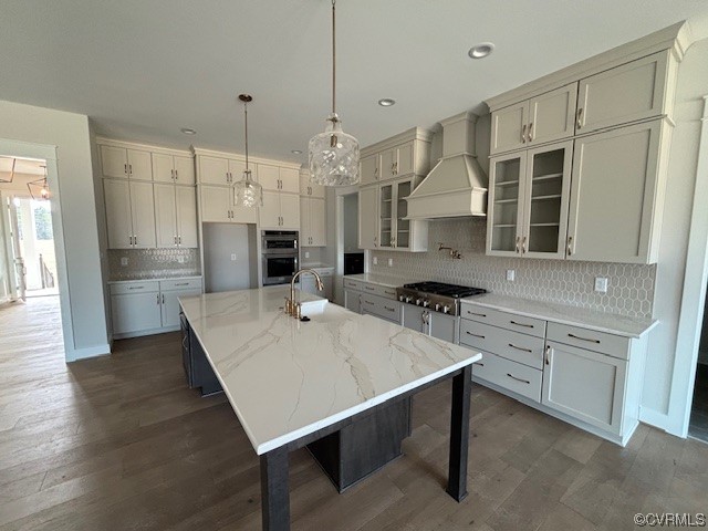 6090 Studley Road Hanover, VA 23069 - Photo 8 of 17 a kitchen with kitchen island a wooden floor and white appliances