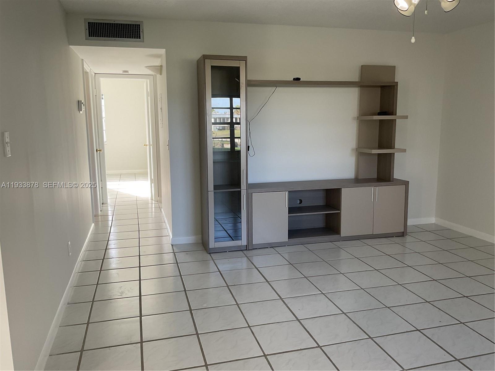 485 Flanders P, Unit 485 Delray Beach, FL 33484 - Photo 13 of 42 a view of a livingroom with an empty space