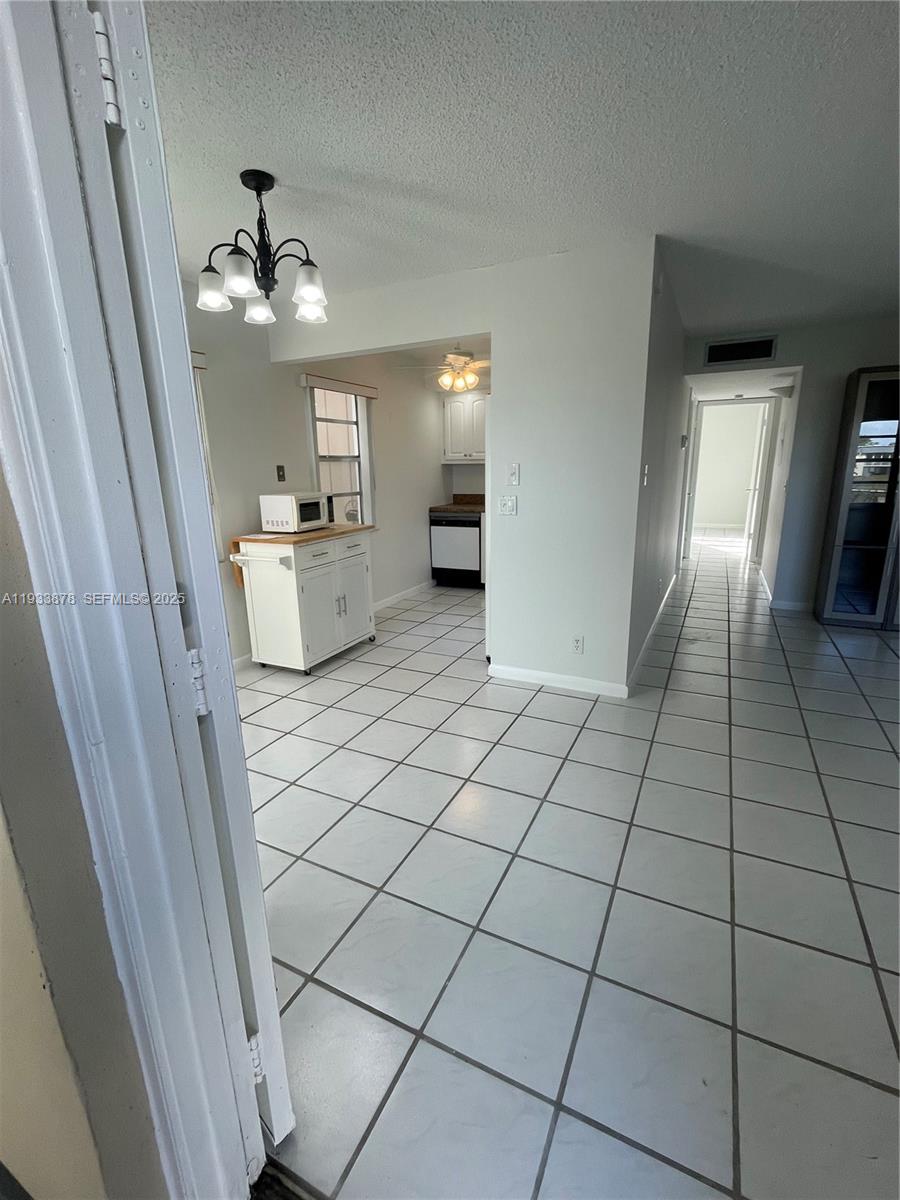 485 Flanders P, Unit 485 Delray Beach, FL 33484 - Photo 6 of 42 a view of an empty room and fire place