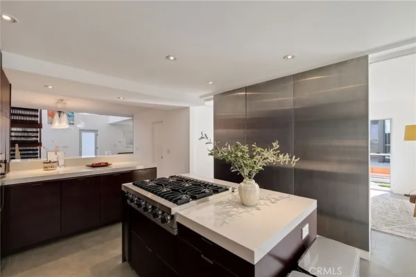 a very nice looking room with many windows and furniture