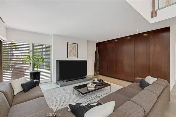 a view of a livingroom with furniture and a window
