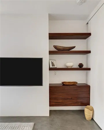 a bedroom with a bed and cabinets